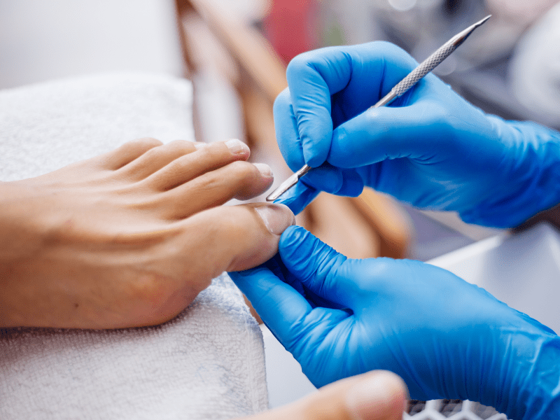 122f07d0 pedicure process home salon pedicure foot care treatment nail process professional pedicures master blue gloves make pedicure 2 min.png